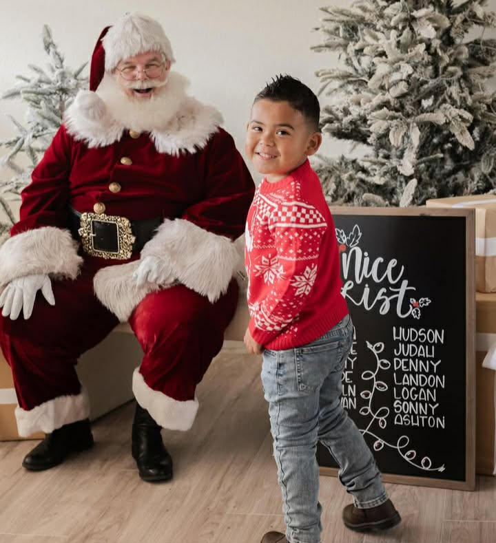 Santa with child on nice list